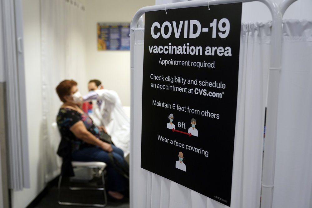 Americans vaccinated against COVID-19 still wait for advice