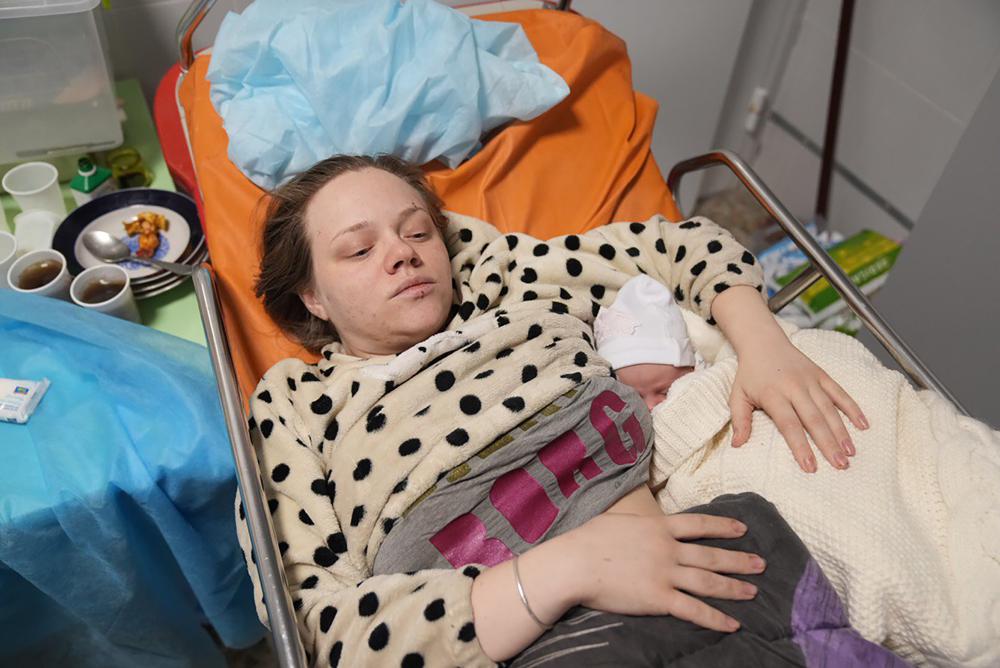 Amid Mariupol horror, a newborn rests in her mother’s arms