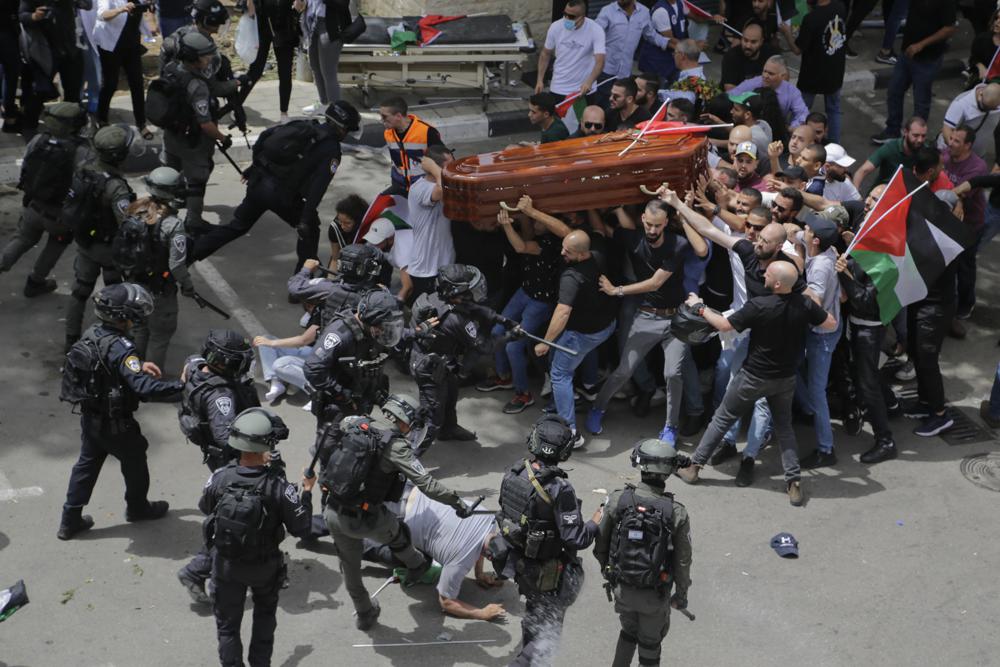 Israeli police beat pallbearers at journalist’s funeral