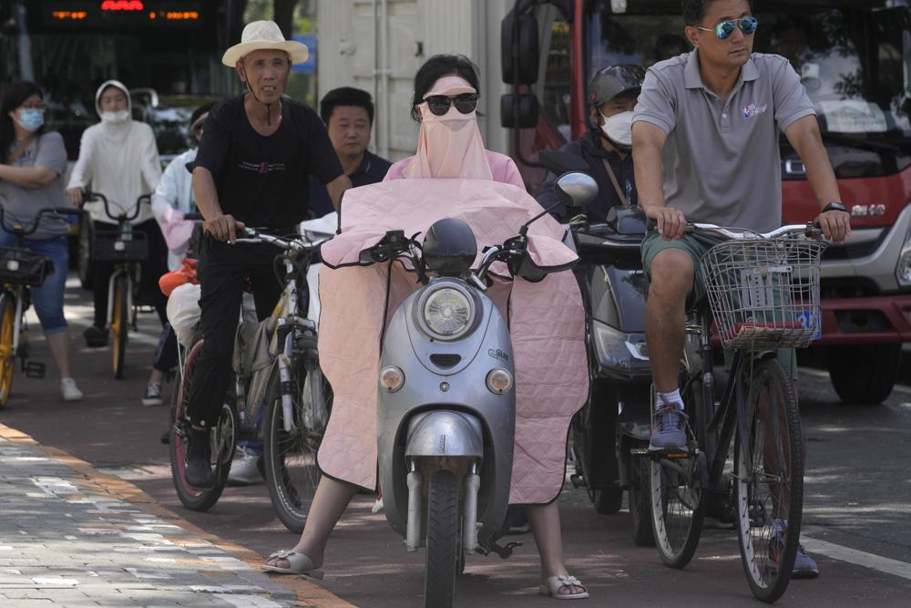 Heat wave, flooding leave multiple people dead in China