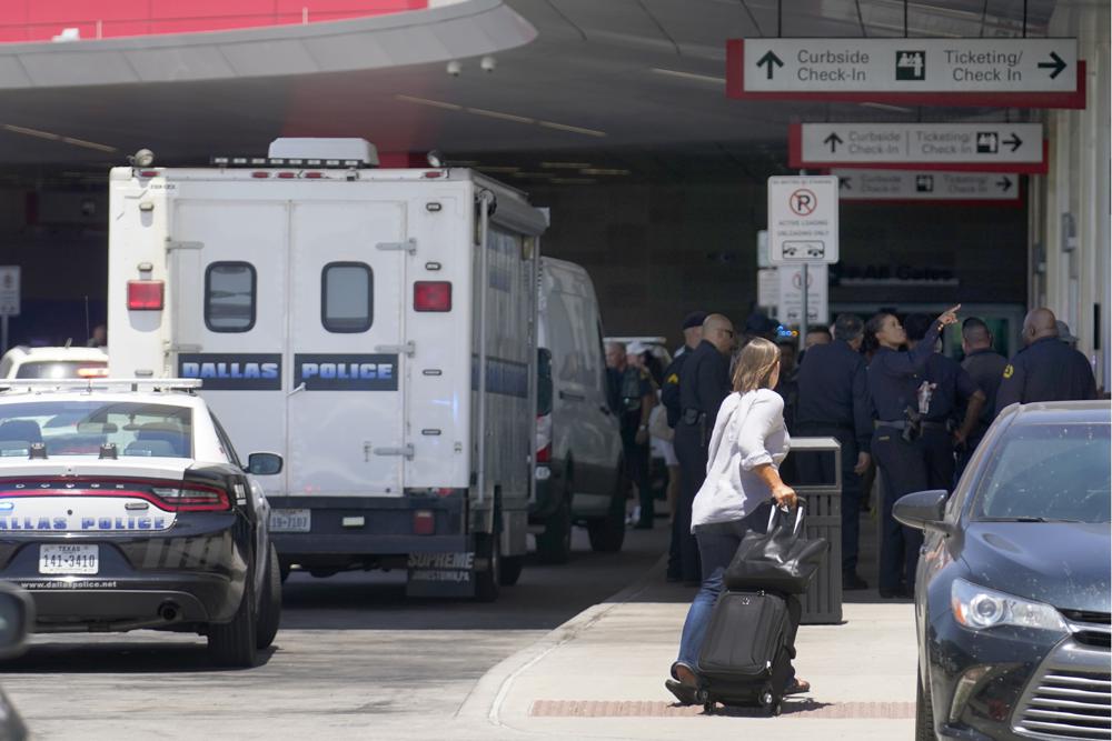 Woman opened fire in Dallas airport; cop shot her