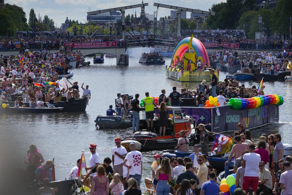 Huge crowds watch Amsterdam Pride’s canal parade celebration