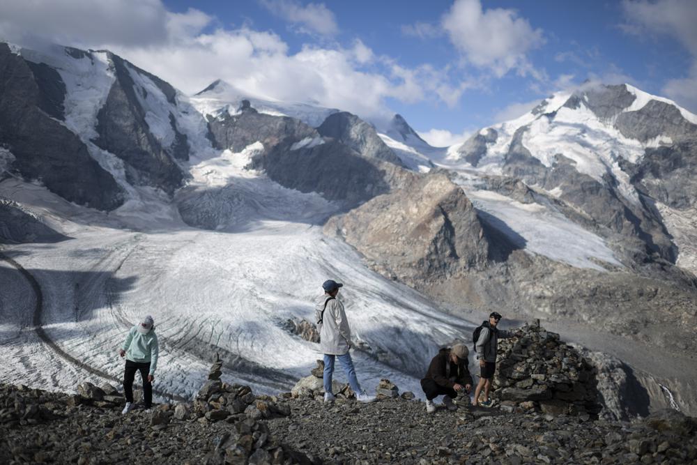 Already shrunk by half, Swiss glaciers melting faster