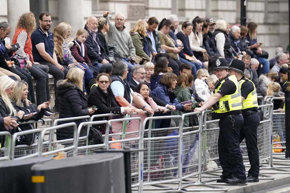 Crowds gather in London to see queen’s coffin procession