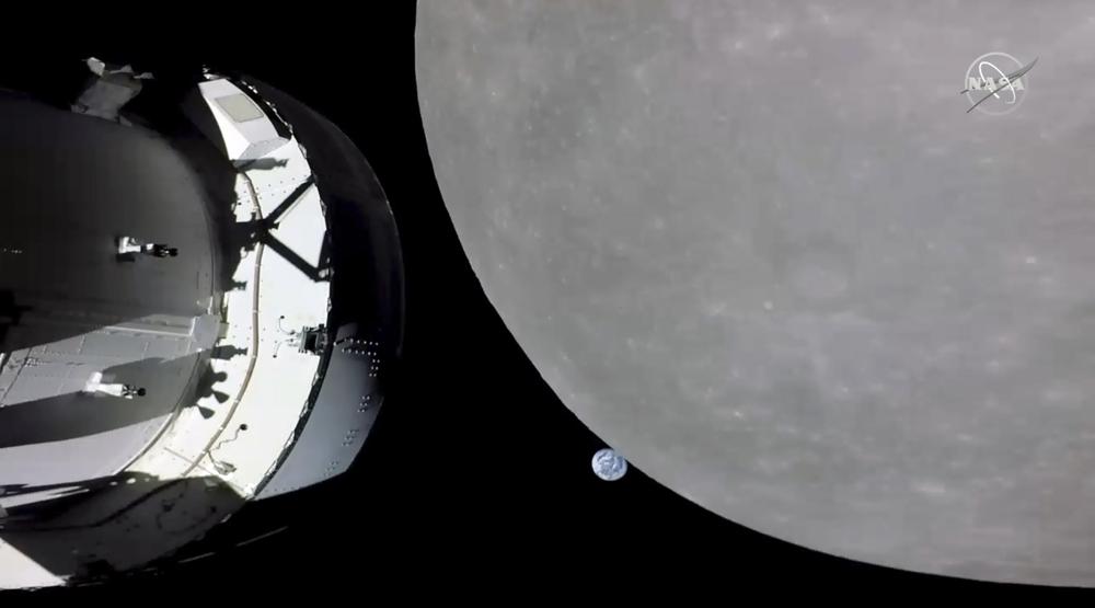 NASA capsule buzzes moon