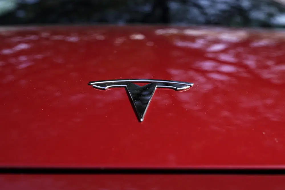 Tesla says it will cut costs of next generation cars in half