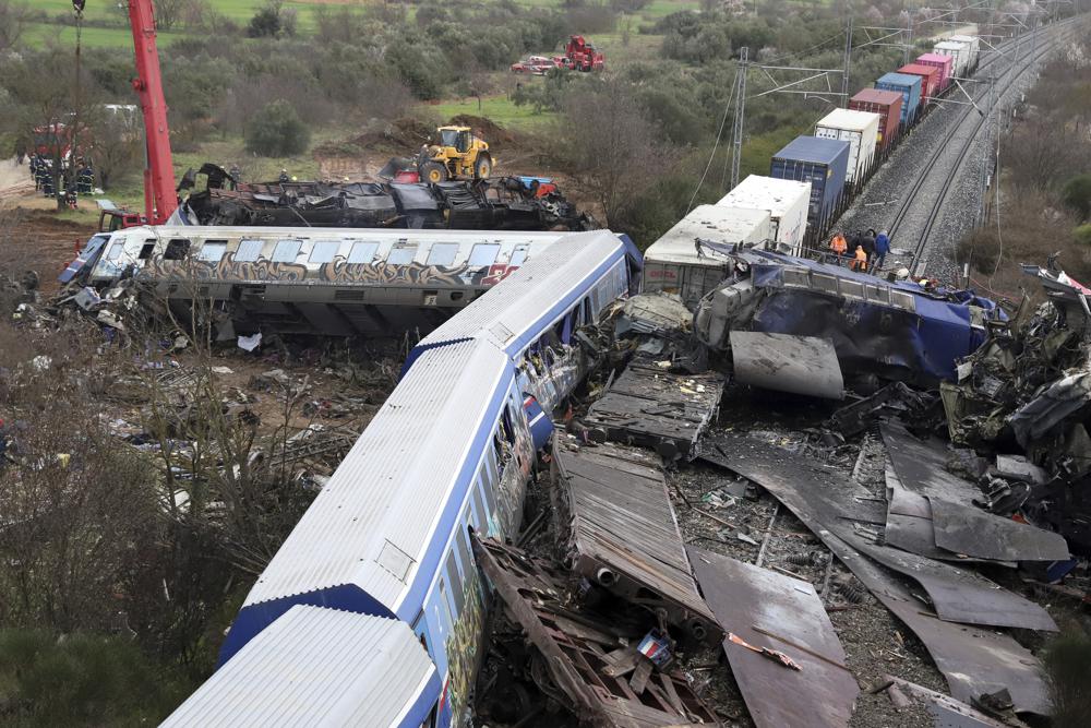 Rescuers comb wreckage of train crash