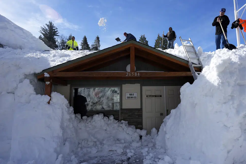 Volunteers in mountain towns dig out snow-stuck