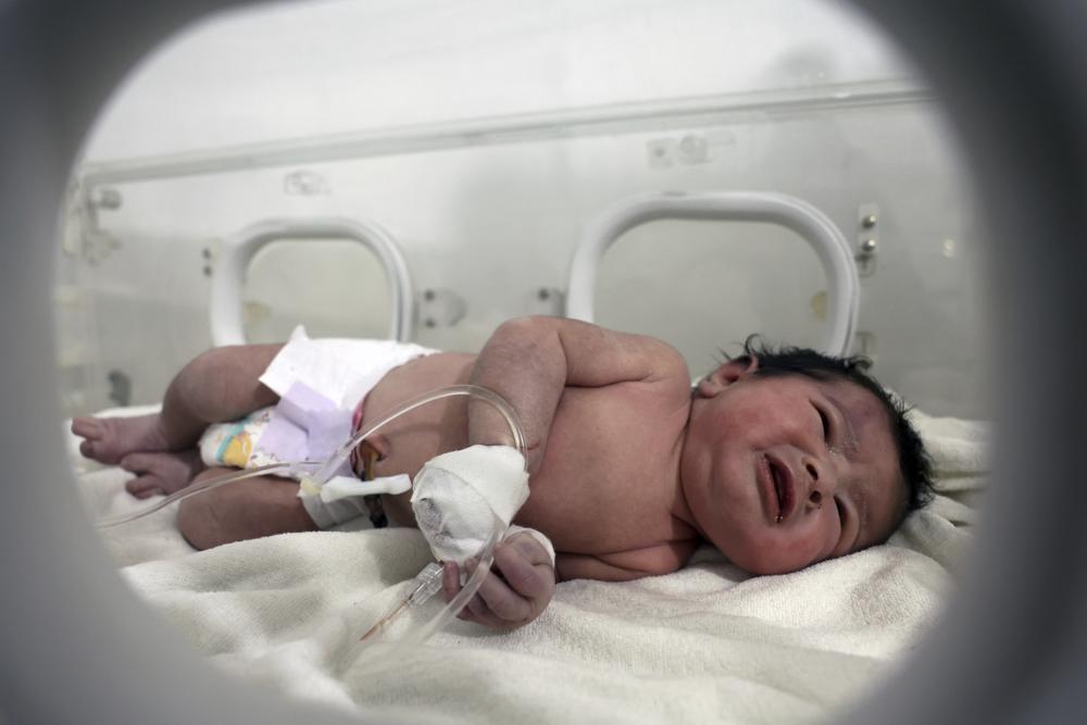 Newborn saved from rubble in Syria