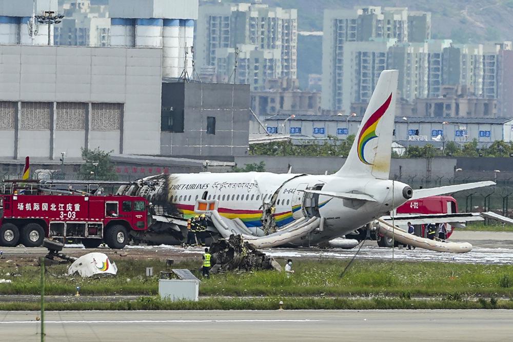 Plane veers off runway in China and catches fire