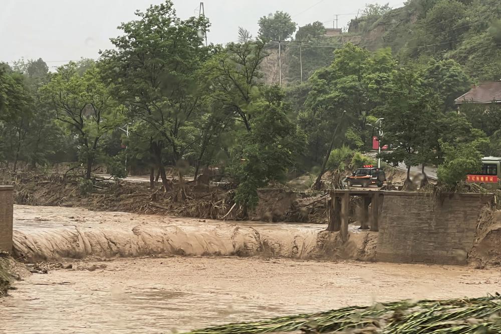 China floods leave at least 12 dead, thousands evacuated