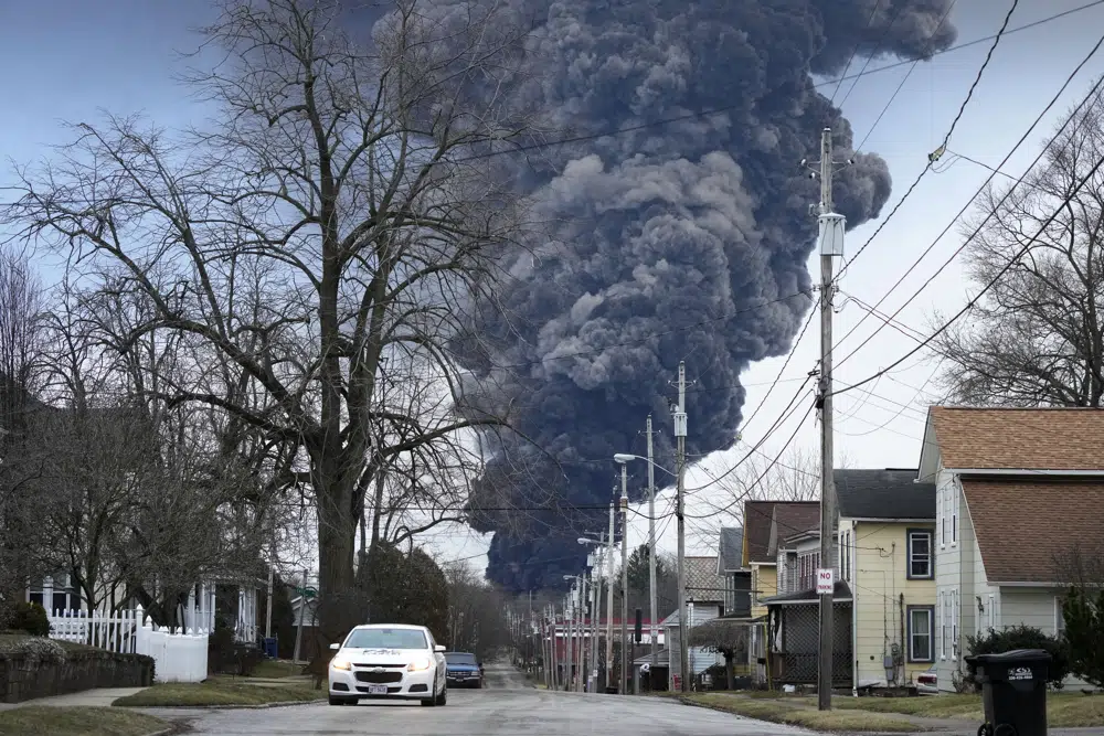 Crews release toxic chemicals from derailed tankers