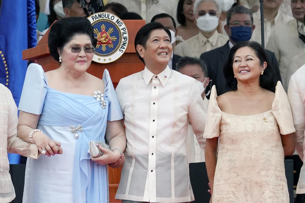 Marcos takes helm in Philippines, silent on father’s abuses