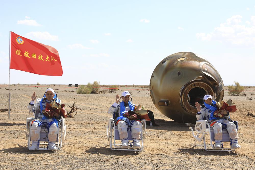 Chinese spaceship with 3 aboard docks with space station