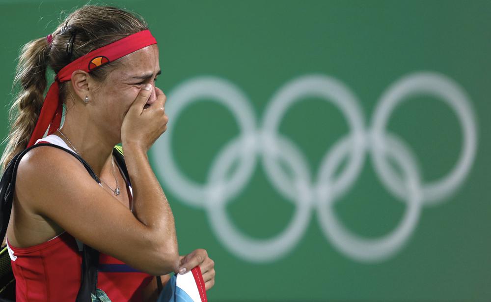 Olympic tennis gold medalist Monica Puig to miss Tokyo due to injury