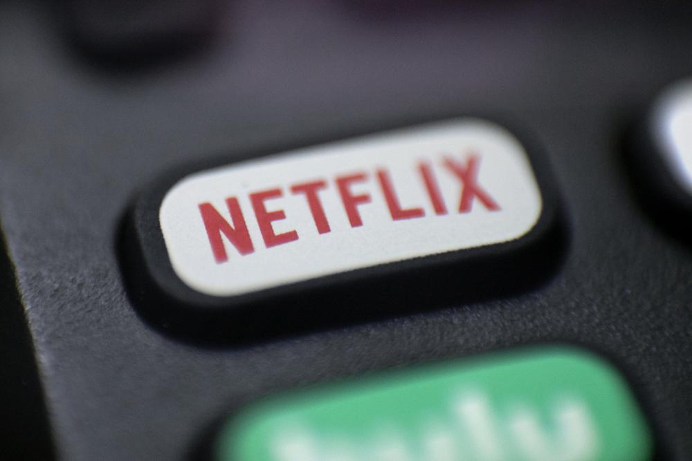 Netflix aims to curtail password sharing, considers ads