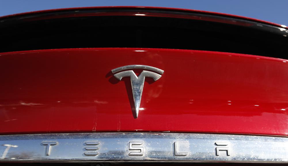 Tesla posts record profit, won’t produce new models in 2022