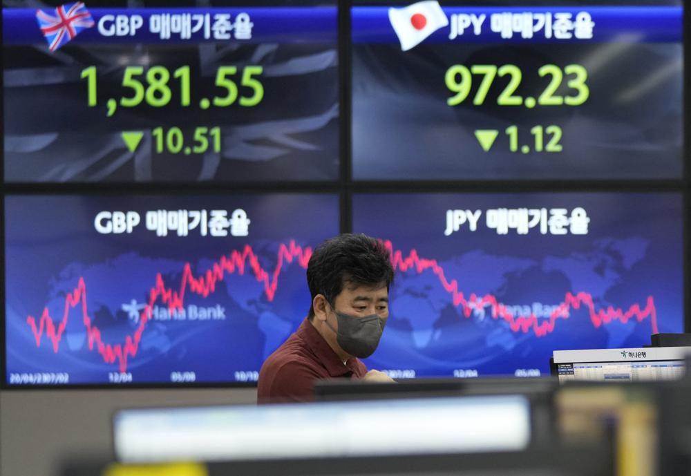 Asian shares mixed as Australia hikes interest rate