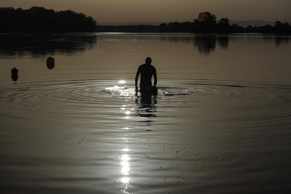 Persistent heat wave breaks records, spirits