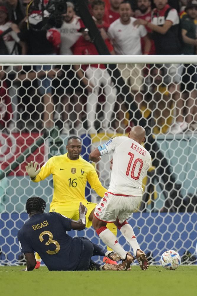 France loses to Tunisia 1-0 but still wins World Cup group