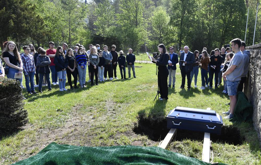 Peace at last: German students bury classroom skeleton