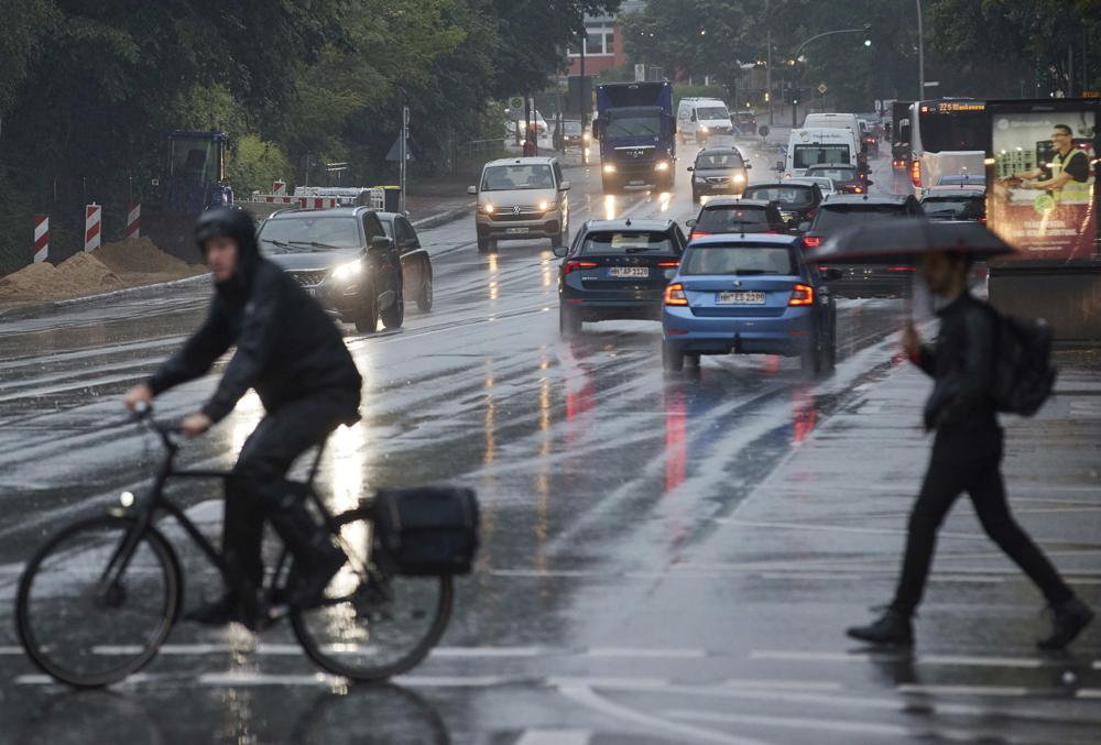 Rainstorms bring relief as Europe suffers deadly heatwave