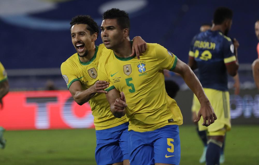 With controversy, Colombia falls to Brazil but advances