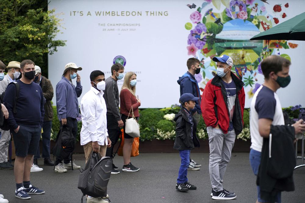 Wimbledon is back … so are the queues and rain