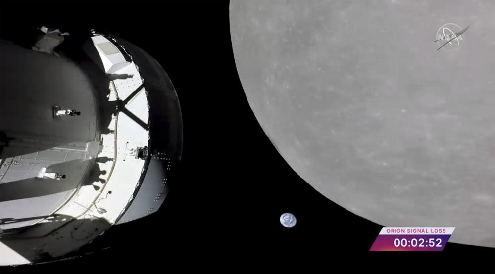 NASA capsule buzzes moon, before lunar orbit