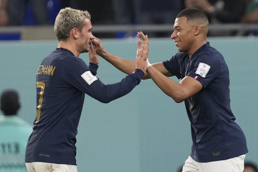 Mbappe scores 2, France reaches knockout stage