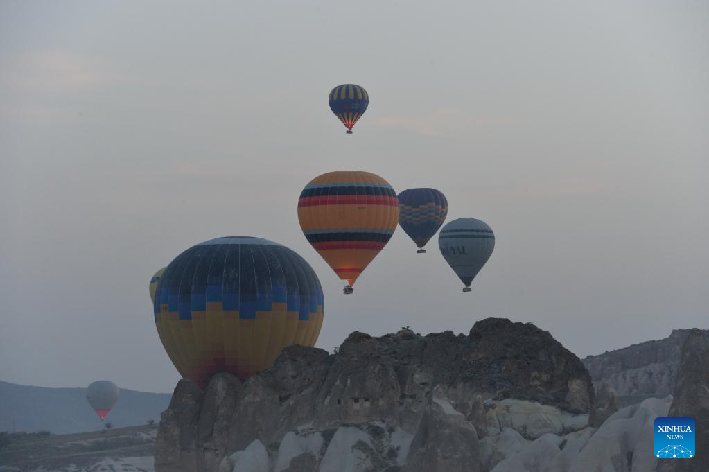 Hot air balloons fly over Cappadocia