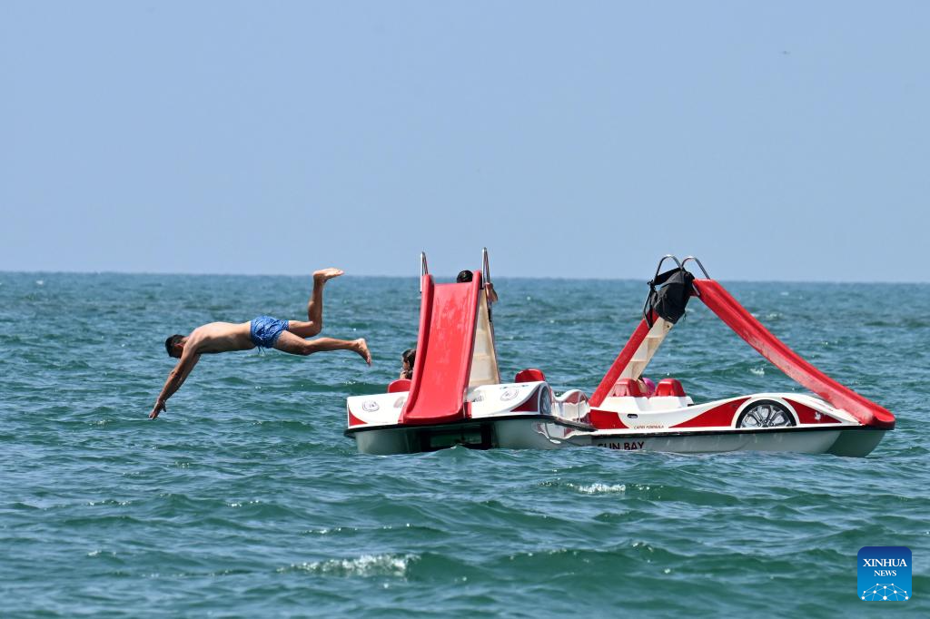 People enjoy leisure time on sea in Italy