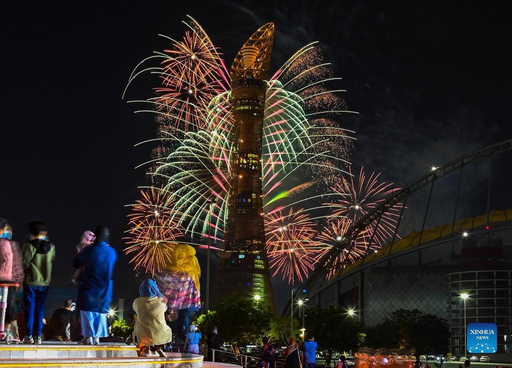 People watch fireworks on eve of Qatar National Day in Doha