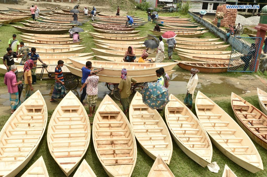 Monsoon season sees sales of hand-made wooden boats in Bangladesh