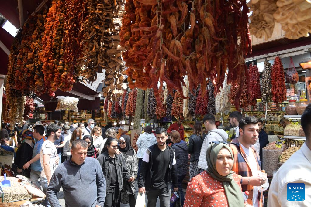 People shop at local bazaar for upcoming Eid al-Fitr