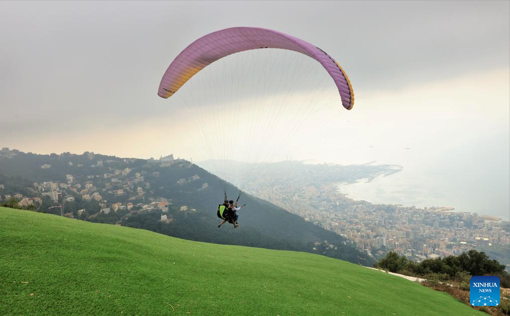 Tourists experience paragliding in Lebanon