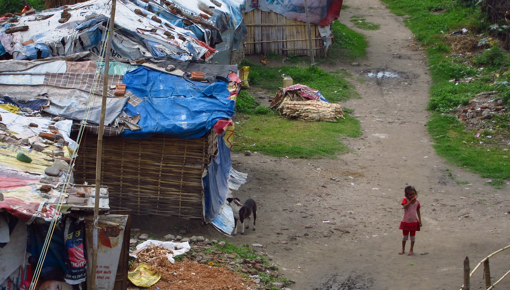 Why are city slums increasing in Nepal?