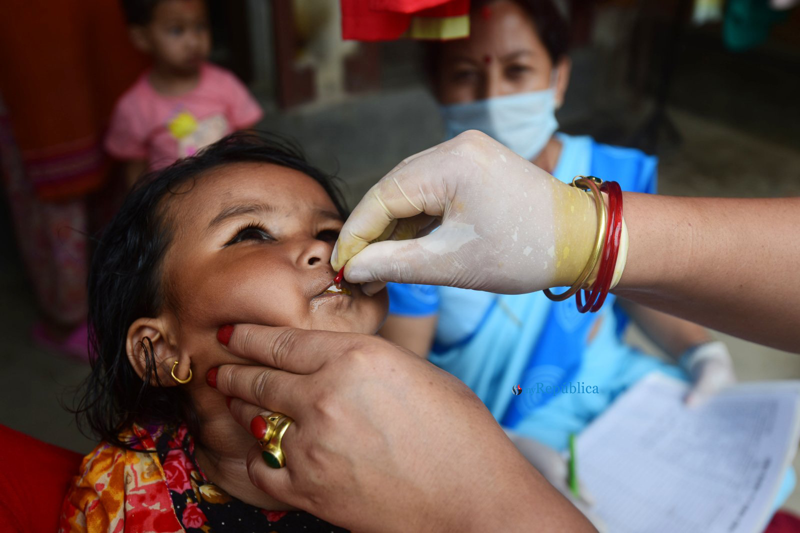 Vitamin ‘A’ and deworming medicine being given to children