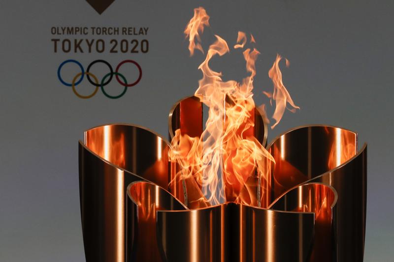 Brazil great Zico celebrates Tokyo torch relay, blasts Rio’s