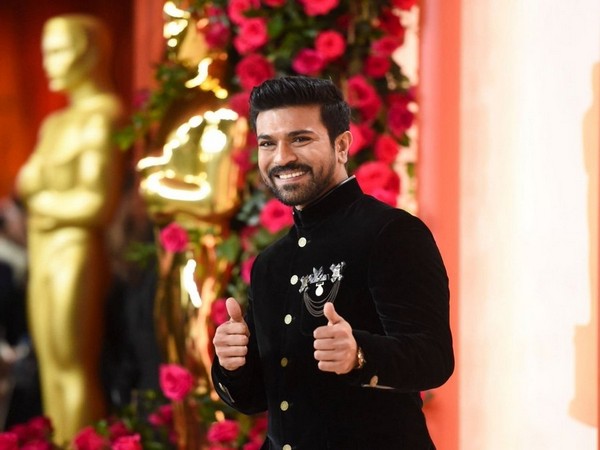 Oscars 2023: Ram Charan showered with flower petals