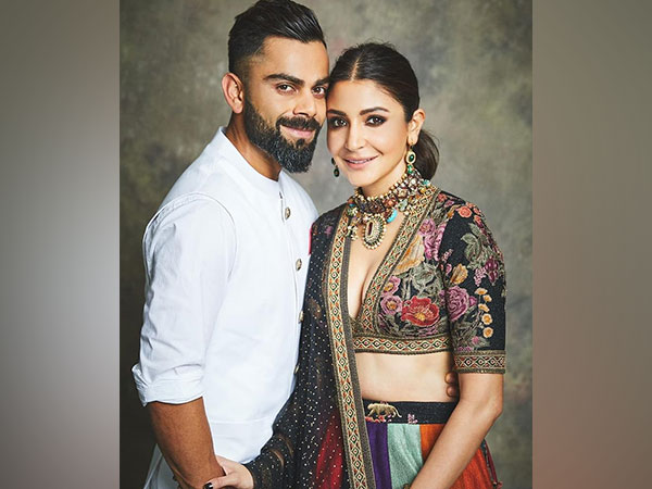 Virat and Anushka celebrating RCB victory