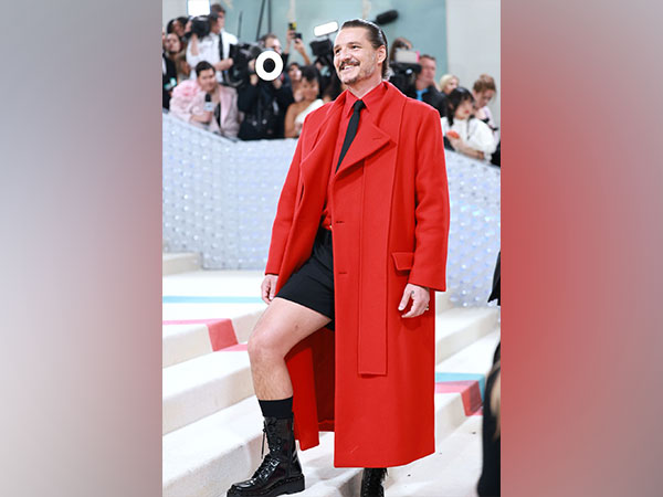 Pedro Pascal rocks red overcoat with black shorts look at Met Gala