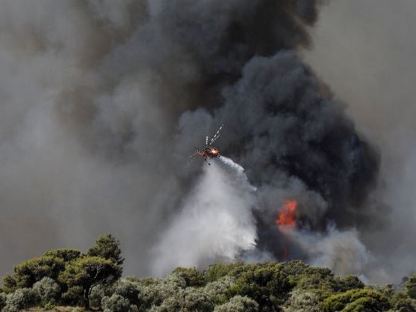 Wildfires rage in Greece amid searing heatwave across Europe