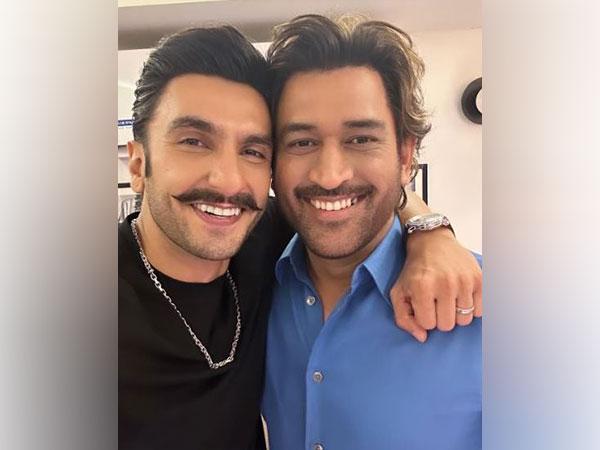 Indian actor Ranveer Singh poses with “Mera Mahi” MS Dhoni