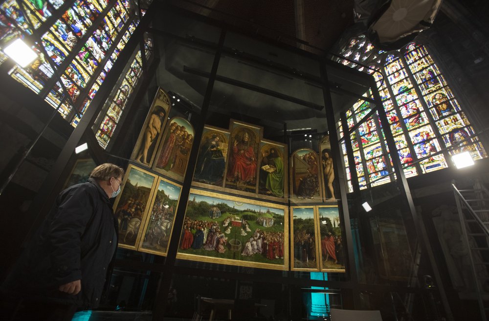 Belgium shows restored masterpiece but stolen panel rankles