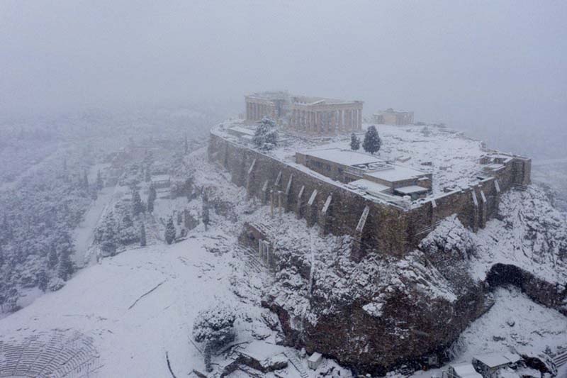 In Athens, rare snow blankets Acropolis, halts vaccinations