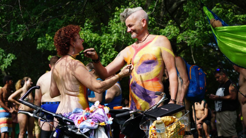 No clothes needed on bike ride, just a mask