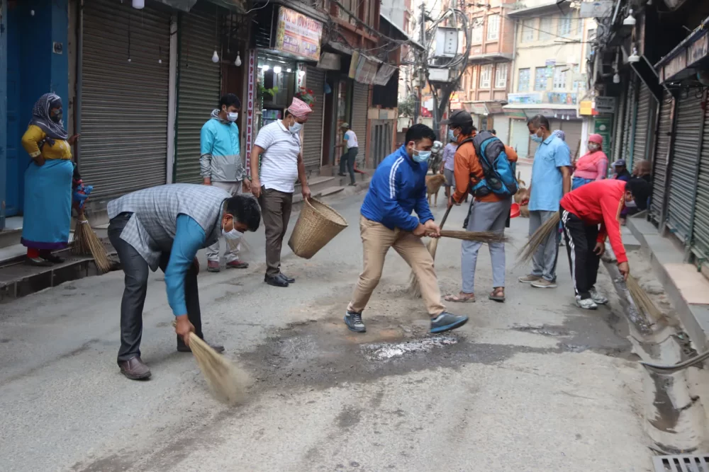 Businessmen and house owners involved in cleaning Thamel