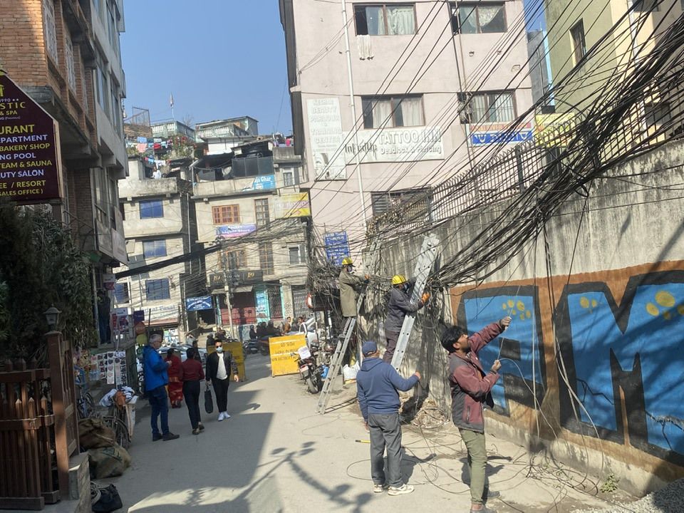 Unorganized wires in Thamel being removed