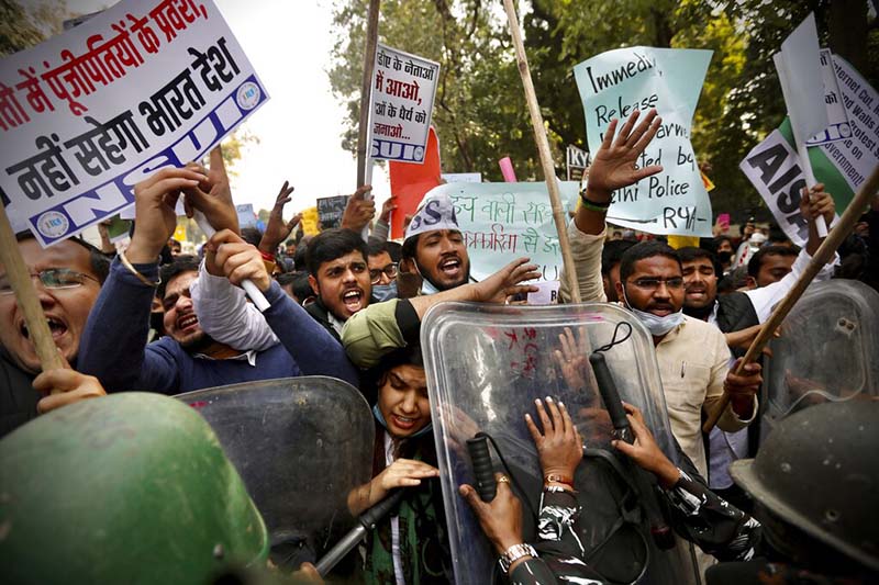 Supporters of protesting Indian farmers scuffle with police